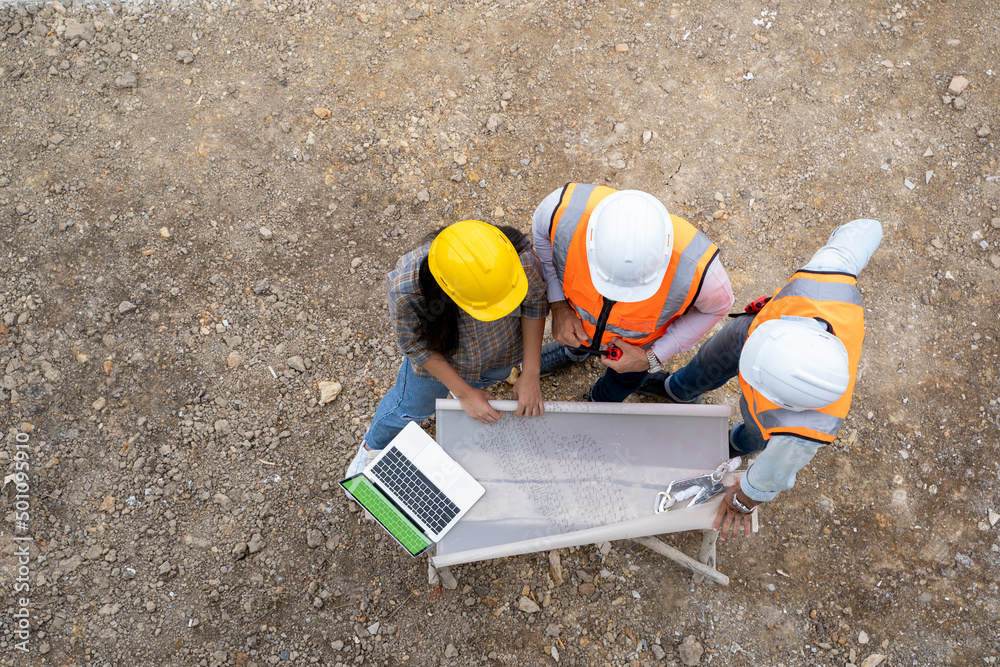 Aufkleber Architect and engineer foreman in helmet working on a building site,Civil engineer project construction work.