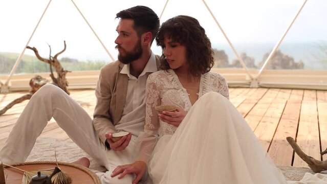 Tea ceremony at a boho wedding. Bride and groom in boho.