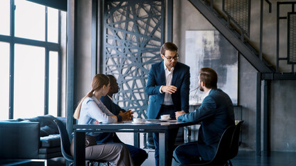 Corporate leader manager communicating with his team about a new project