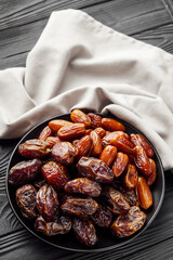 juicy royal dates on a black wooden rustic background