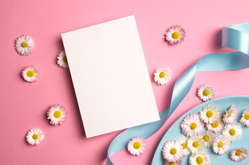 Greeting or invitation card mockup with ribbon and white daisy flowers