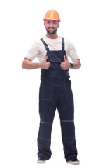 smiling man in overalls showing thumbs up . isolated on white