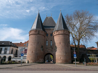 Church 'Bovenkerk' and city gate in historical city Kampen in the Netherlands. Aerial - obrazy, fototapety, plakaty