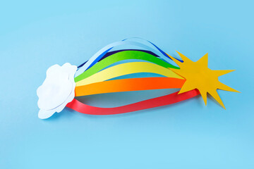 Colored Rainbow and white clouds from paper. DIY and kid's creativity. Children's DIY crafts to...