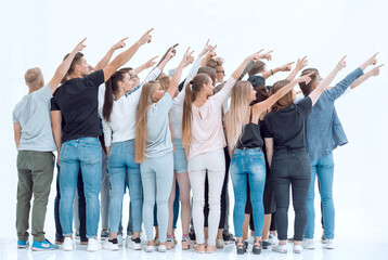 Obraz premium rear view. group of young people pointing in one direction