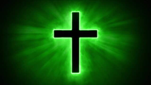 Uplifting and deeply inspiring reveal animation of a plain classic green holy Christian crucifix cross, in a smoky mystical glow and emating shining God rays and light beams, on a black background