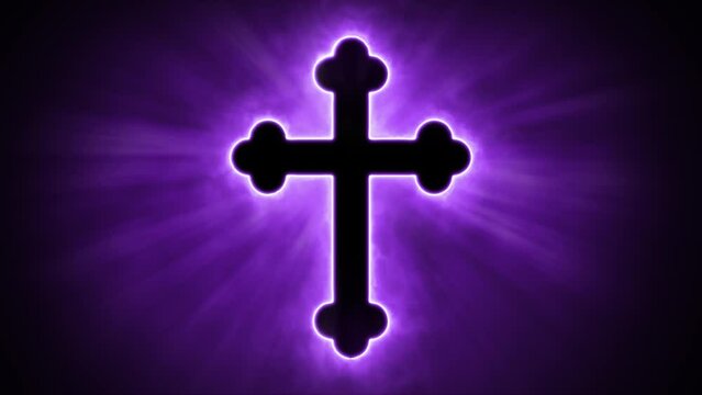 Uplifting and deeply inspiring reveal animation of an ornate and holy purple Christian crucifix cross, in a smoky mystical glow and emating shining God rays and light beams, on a black background