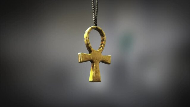 High quality close up render of a beautiful antique gold Egyptian Ankh artifact swinging slowly on the end of a neck chain, with super shallow depth of field abd bokeh background