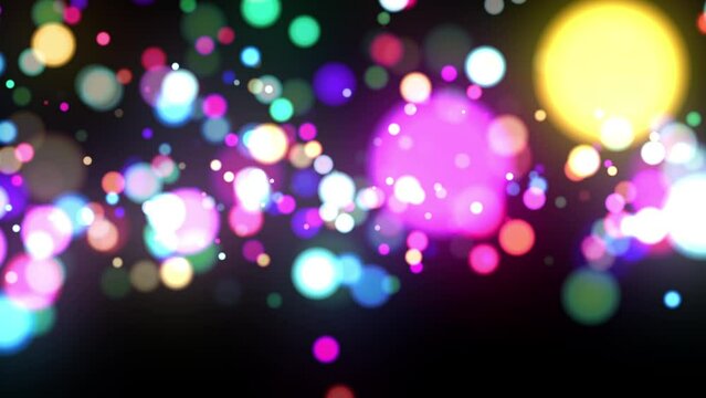 カラフルでポップなパーティクル　ゆっくりバウンドとメリハリのある横回転　ループ