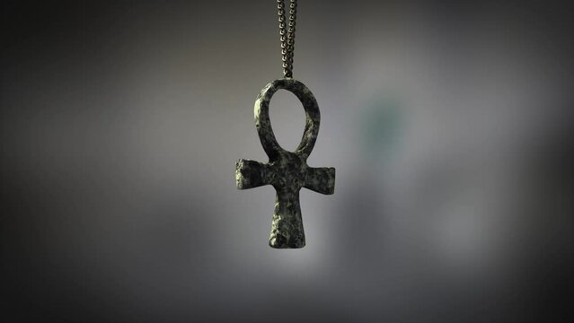 High quality close up render of a beautiful antique carved marble Egyptian Ankh artifact swinging slowly on the end of a neck chain, with super shallow depth of field abd bokeh background