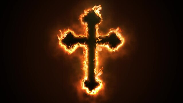 Exciting and highly emotive reveal animation of an ornate Christian Crucifix cross, in roaring flames, burning embers and sparks, on a smokey, glowing black background