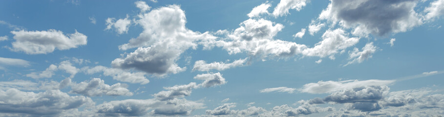 Naklejka na ściany i meble Background of light blue sky with white clouds at the bottom