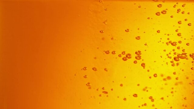 Super slow motion of macro shot of pouring beer drink, close-up. Filmed on high speed cinema camera, 1000 fps.