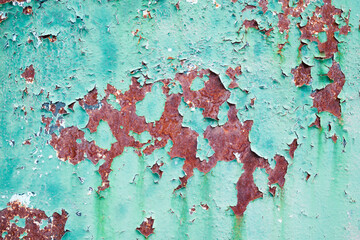 Old weathered blue painted wall background texture.