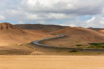 Hverir hill S curve road images Iceland cloud sky car on the road