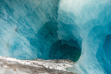 blue ice cave covered with snow