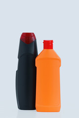 Two bottles household chemicals. White background.