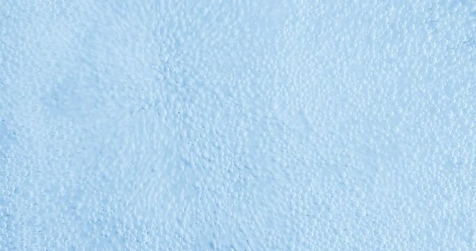 Oxygen bubbles in water on a blue abstract background