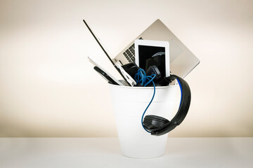 Planned obsolescence, e-waste, electronics waste for reuse and recycle concept. Recycling bin full...