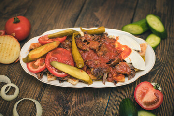 turkish national food iskender or iskender kebab with yogurt and herbs