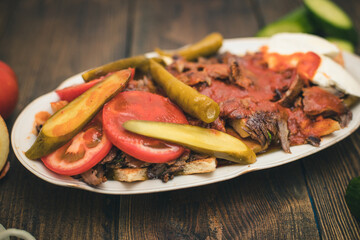 turkish national food iskender or iskender kebab with yogurt and herbs