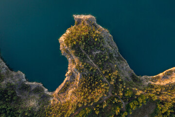 Top view of turqouse lake shore at sunset