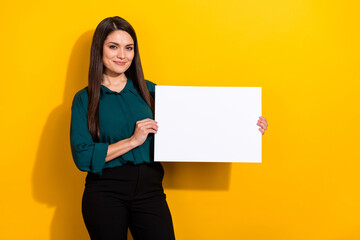 Fototapeta na wymiar Photo of sweet shiny woman wear green shirt rising white empty space isolated yellow color background