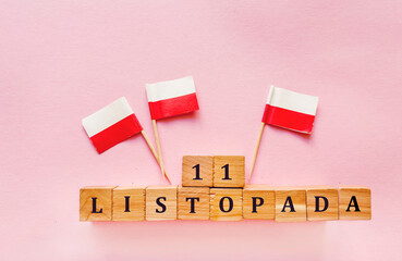 11 November written in Polish Language . Independence Day Greeting Card with Poland Flags 