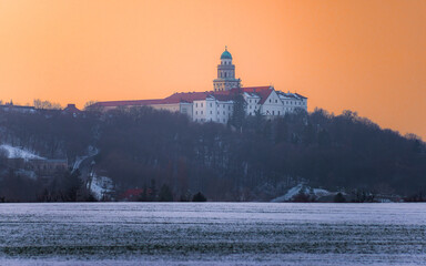 Pannonhalma Archabbey at the sunset time in the winter, Hungary