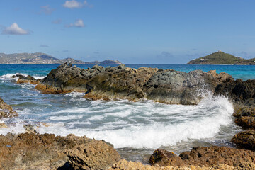 The ocean crashing into the rocks of St Thomas.