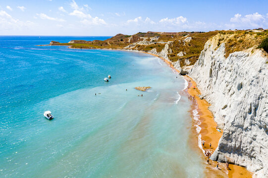 Aerial view of majestic limestone cliffs framing the golden sand of Xi beach, Kefalonia, Ionian Islands, Greek Islands