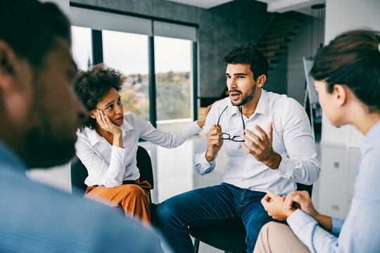 A man talking about issues in circle at support group.
