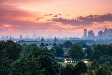 View of Greenwich Old Royal Naval College and London skyline at dusk, Greenwich, London