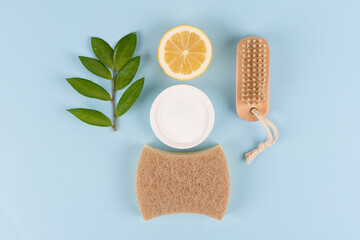 Natural household cleaners - baking soda, lemon, citric acid on blue background. Bio organic...