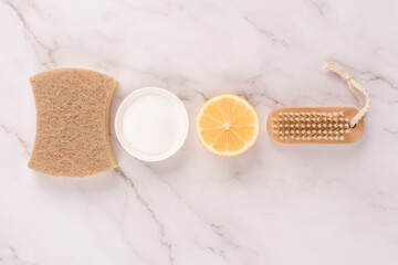 Flat lay composition with natural household cleaners kit with eco ingredients - bamboo brush,...