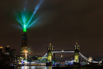 New Year 2022 firework and light display by The Shard and Tower Bridge, London