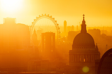 Aerial view of London skyline at sunset, including London Eye and St. Paul's Cathedral, London