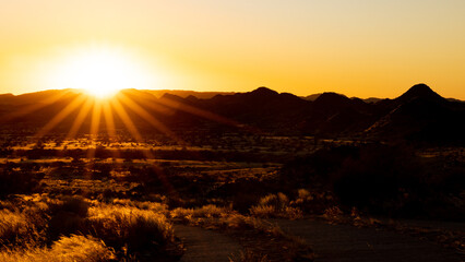 Obraz premium a sunrise over a landscape 