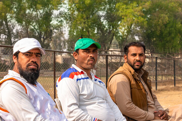 cricket coach looking to the cricket players' team 