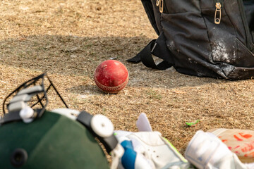 cricket ball with bags on the match ground 