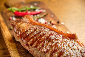 Grilled ribeye beef steak, herbs and spices