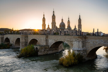 Basilica del Pilar Cathedral with stone bridge crossing Ebro River, Zaragoza, Aragon
