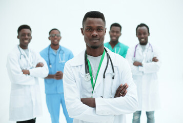 young confident doctor on the background of his colleagues