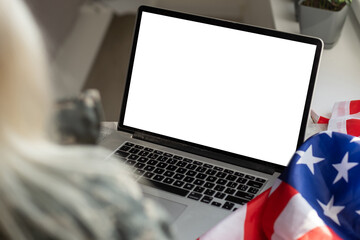 USA Memorial day, Presidents day, Veterans day, Labor day, or 4th of July celebration. Blank screen on modern laptop for mockup design on USA national flag