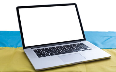 Laptop with blank screen on table and Ukrainian national flag on background, space for text.