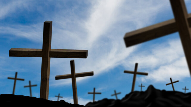 wooden crosses on a background of dramatic sky