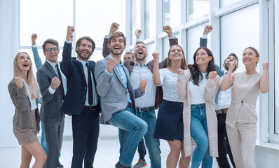 Fototapeta premium in full growth. a group of happy young business people