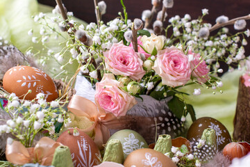 Easter flower decor with pink roses, white gypsophila and willows