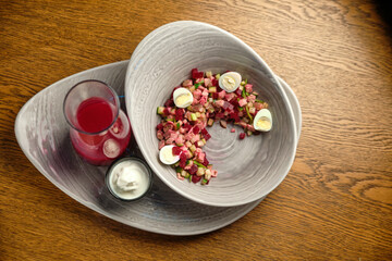 Beef tartar with salad and garlic toast on dark bread