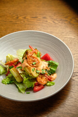 Grilled spicy lamb and salad wrapped in flatbread, with tomatoes